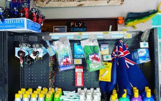 fly poles key chains sun block and the TCI flag for sale at Master Baits Tackle and Fishing shop in Scooter Bobs car rental office in Turtle Cove Turks and Caicos Islands